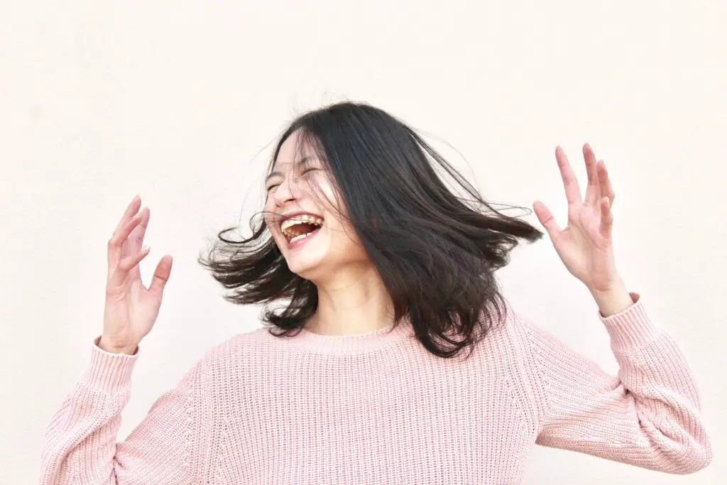 an asian girl having fun and laughing 